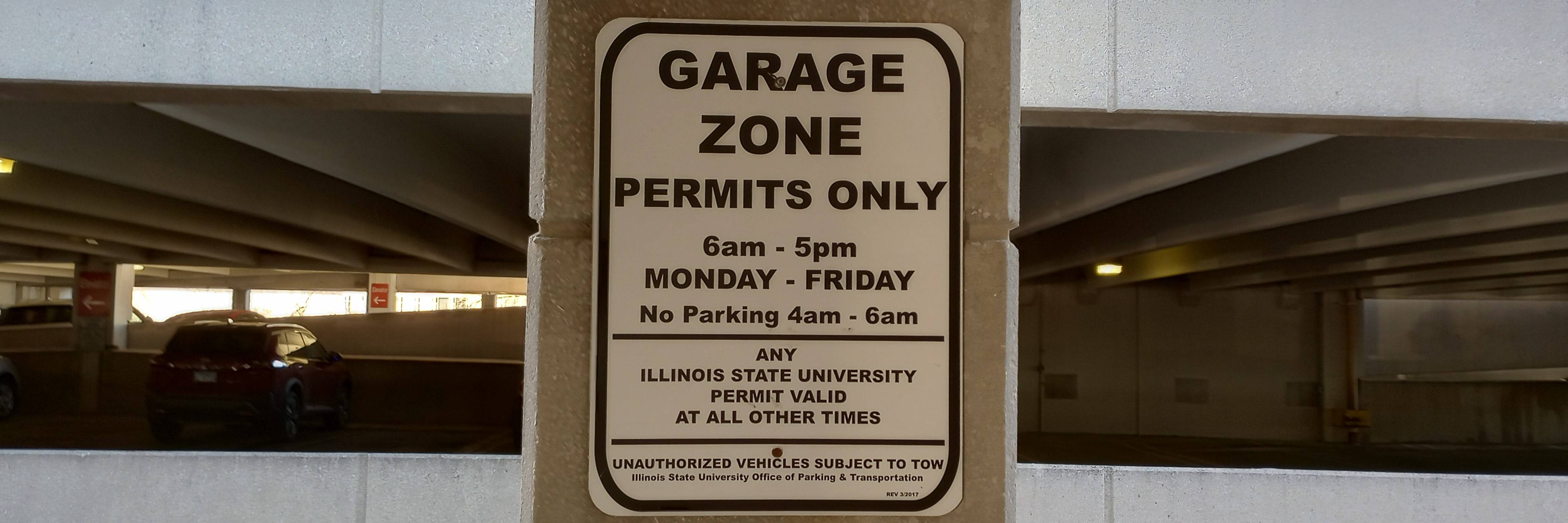 Photo of white Reserved parking sign.