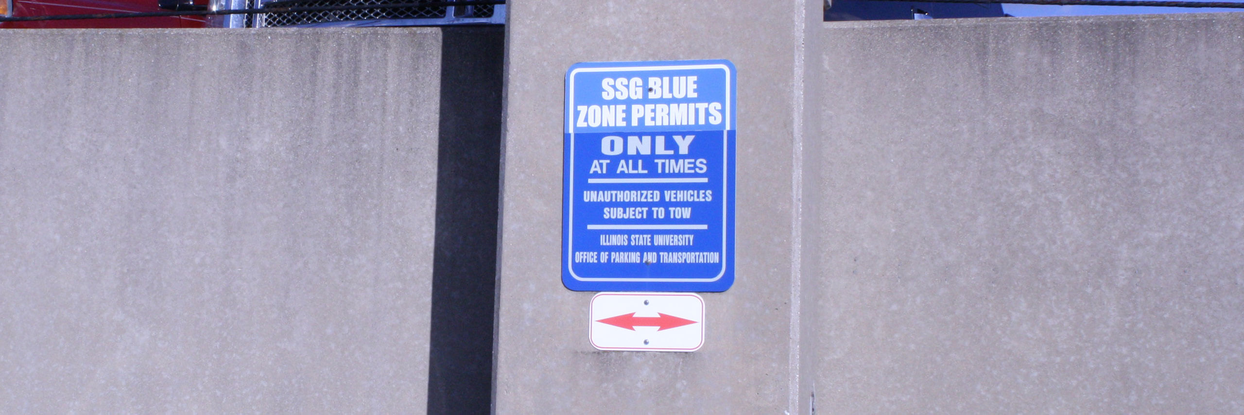 Photo of a blue Campus Resident parking sign.